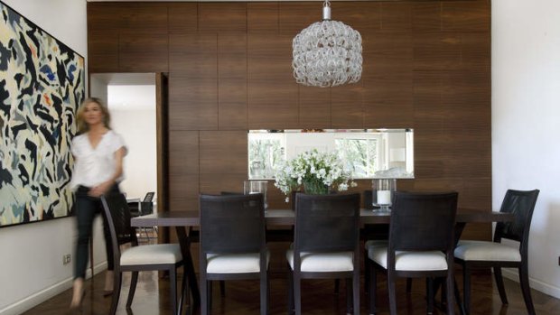 Light fantastic … a Vistosi chandelier hangs above B&B Italia "Maxalto" tables and chairs in the dining area.