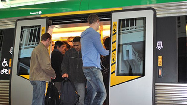 Commuters try to squeeze onto packed trains at Leederville station.
