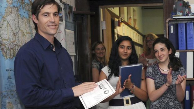 James Foley receives applause from students at the Christa McAuliffe Regional Charter Public School in Massachusetts in 2011.