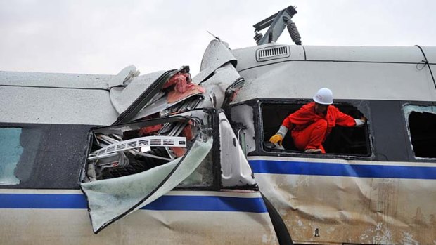 Rescuers workers at a train accident in Wenzhou, eastern China.
