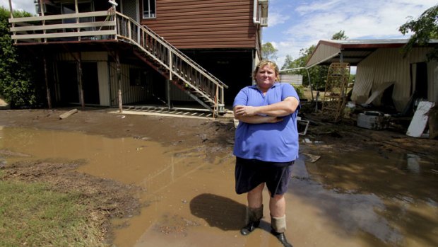 Wendy Linsley's home on Napier Street, Laidley, was again hit by flood waters which devastated the town on Sunday. Wendy wants to move but can't.