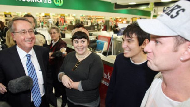 Happier vein ... the Treasurer, Wayne Swan, gets a cordial reception at a shopping centre in Albany, WA, yesterday.
