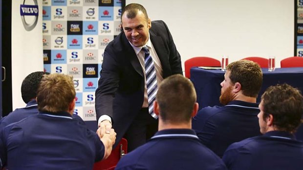 G'day fellas &#8230; Waratahs coach Michael Cheika greets the players at the press conference announcing his signing.