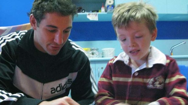 Maroons star Billy Slater finds time to brighten the life of young admirer Preston at Royal Children's Hospital.