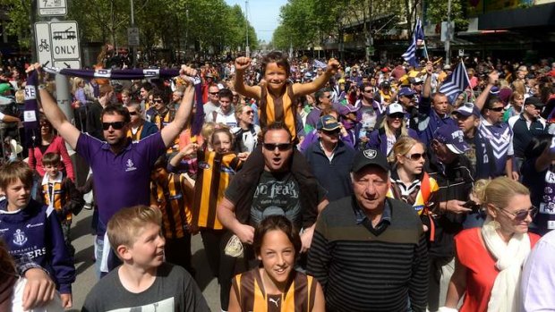 Hawthorn and Fremantle fans soak up the festive atmosphere at Friday's grand final parade.