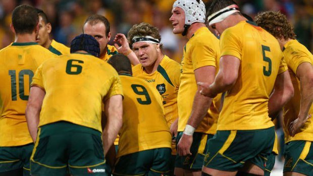 Faces say it: A dejected Wallabies outfit after Saturday's loss to the Springboks.