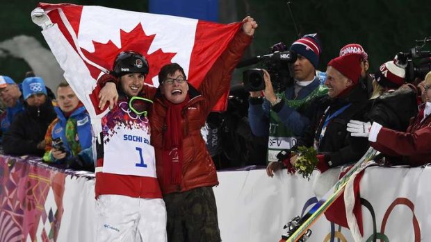 Canada's Alex Bilodeau celebrates with his brother Frederic after claiming gold in the men's freestyle moguls.