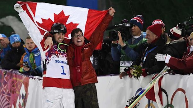 Canada's Alex Bilodeau  celebrates with his brother Frederic after claiming gold in the men's freestyle moguls.