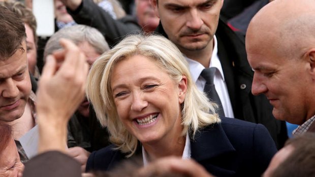 President of the  Front National party Marine Le Pen is greeted by supporters in north-eastern France.