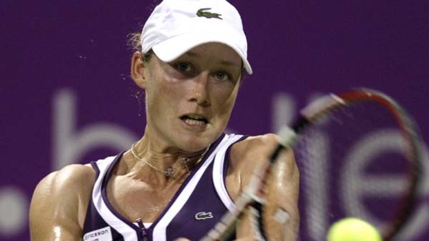 Doha disappointment ... Samantha  Stosur hits a return to Kim Clijsters during the WTA Championships.