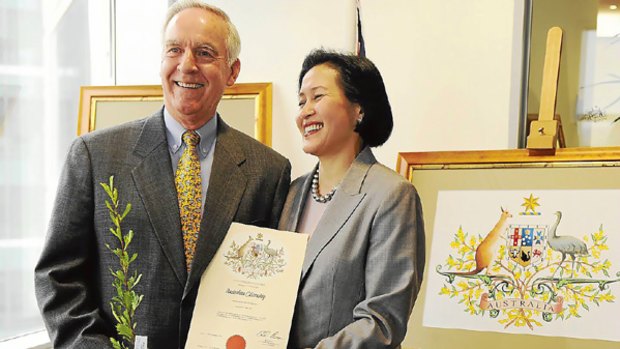 Former US ambassador Douglas Pete Peterson becomes an Australian citizen with wife Vi Le Peterson.