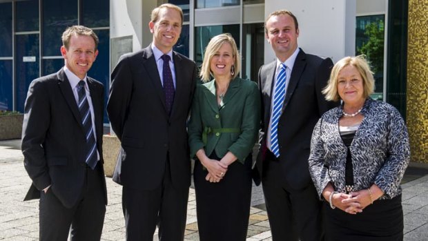 ACT's new cabinet, Greens' Shane Rattenby, with Labor's Simon Corbell, Katy Gallagher, Andrew Barr, and Joy Burch, outside the ACT Legislative Assembly this morning.