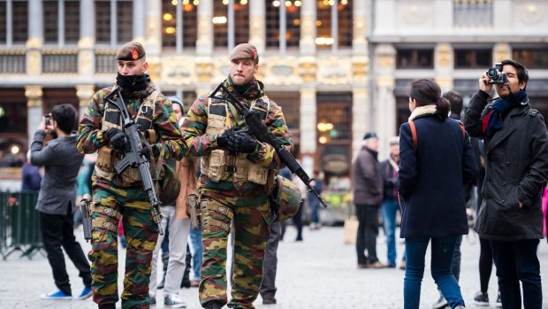Belgian Army soldiers patrol in the picturesque Grand Place in the centre Brussels as the city goes into lockdown.