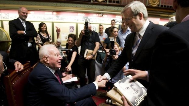 Kevin Rudd shakes hands with Gough Whitlam after launching a biography on the former Labor prime minister at the NSW State Parliament on November 6, 2008.  