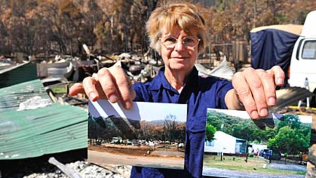 Beverly Prithcett stands in the remains of her home at Creekside Drive, Flowerdale. She and her husband John have camped at the site waiting for insurance assessors to arrive.
