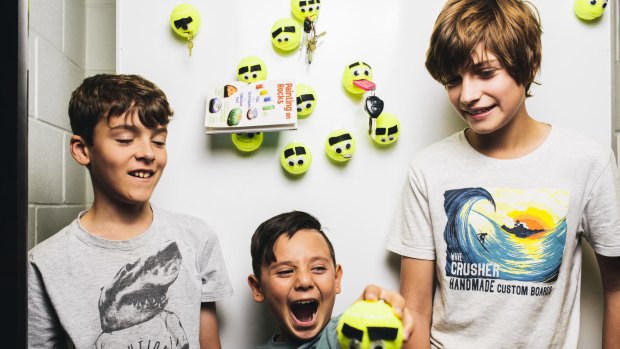 Kidpreneurs Sam Mckinney (11), Charlie Habda (8) and Ethan Allen (12) with their tennis ball key holders. 
