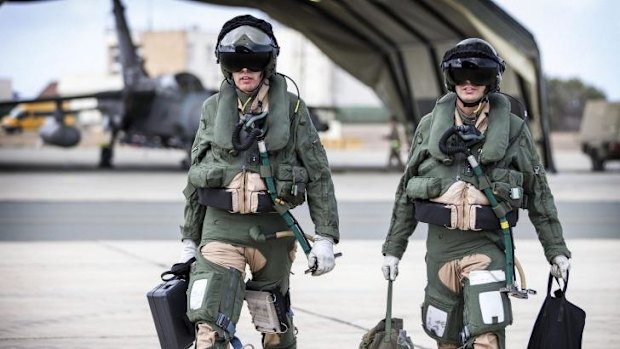 The flight crew of an RAF Tornado GR4 prepare to begin a combat mission after Britain's parliament approved air strikes against Islamic State (IS) insurgents in Iraq by a decisive margin on Friday, paving the way for the Royal Air Force to join US-led military action with immediate effect.