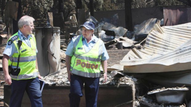 Police Chief Nixon tours the fire ravaged Kinglake town.