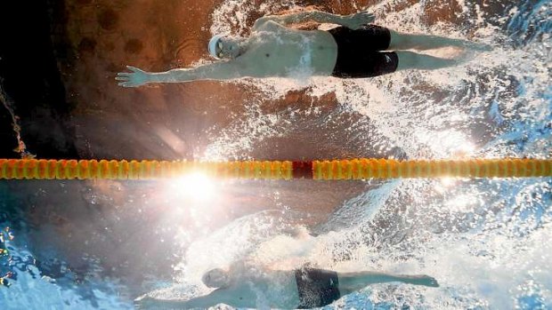 Head to head: China's Sun Yang, top, against Ryan Cochrane in the men's1500m freestyle final.