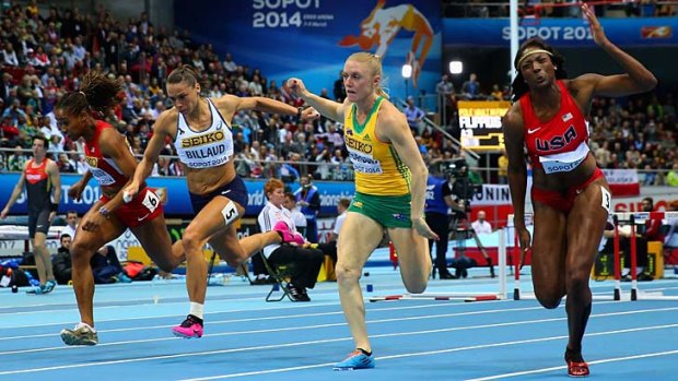 American Nia Ali (right) beats home Australia's Sally Pearson by five-hundredths of a second.