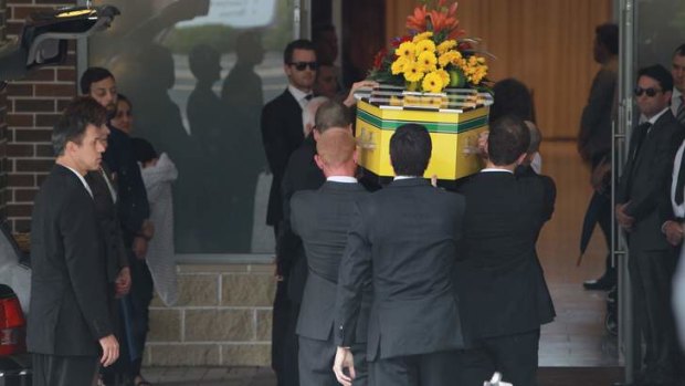 Final farewell: Friends and family at the funeral of Morgan Huxley at Macquarie Park Crematorium.