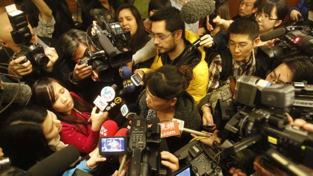 A relative of a passenger onboard Malaysia Airlines flight MH370 answers media questions.