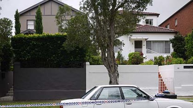 The house, left, where the victim was found  seriously injured at Bundock Street, Randwick.