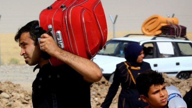 Refugees fleeing from Mosul head to the self-ruled northern Kurdish region in Erbil.