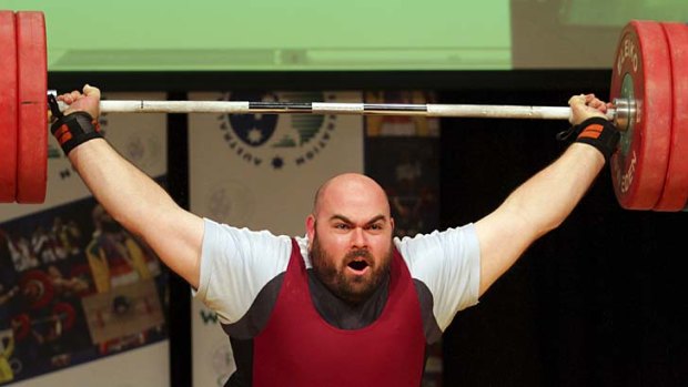 Going for gold ... Damon Kelly competes in the super heavyweight division of the Australian Weightlifting Federation Olympic trials in June this year.