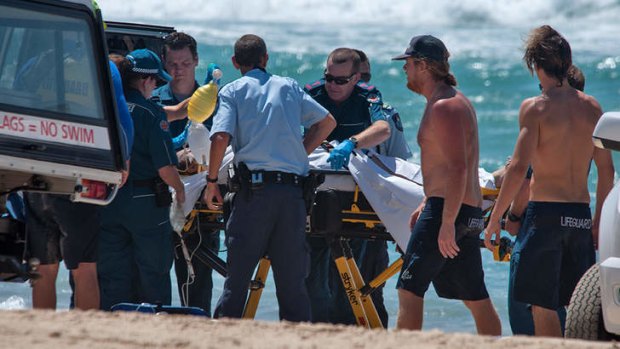 Paramedics attempt to resusitate a man on Main Beach.