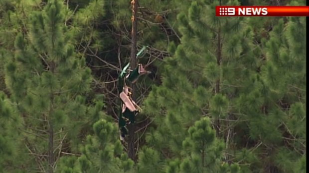 The wreckage of an ultralight plane that went down near Caboolture on Monday.