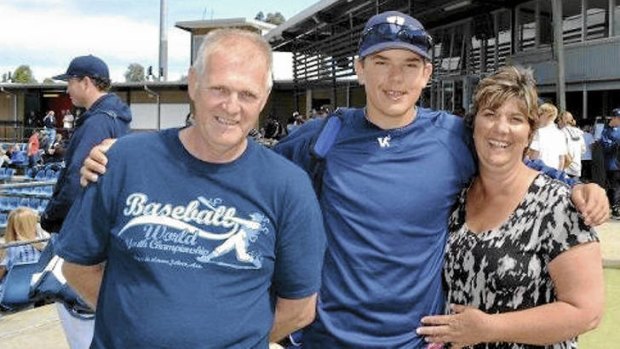 Take me out to the ball game … Lewis Thorpe with his parents, Ross and Lyn, earlier this year.