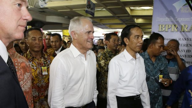 Prime Minister Malcolm Turnbull walks with Indonesian President Joko Widodo during their visit at Tanah Abang Market in Jakarta, Indonesia last month.