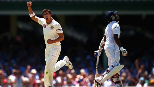 Key wicket &#8230; Mitchell Starc celebrates at the SCG on Thursday after dismissing Mahela Jayawardene.