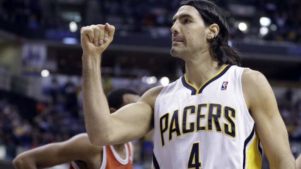 Indiana Pacers forward Luis Scola celebrates a foul called against the Milwaukee Bucks in the second half in Indianapolis. The Pacers defeated the Bucks 104-77.
