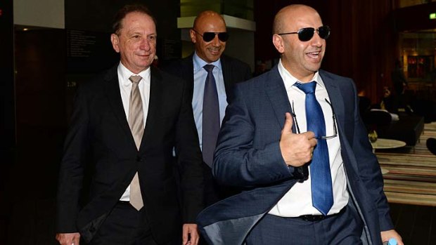 Questioned: Moses Obeid, centre, with brother Paul, right, and lawyer Michael Bowe leaving the inquiry.