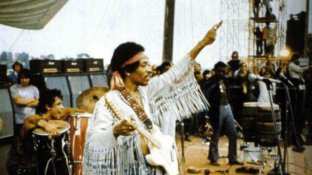 Jimi Hendrix at Woodstock with amplifiers designed by Jim Marshall.