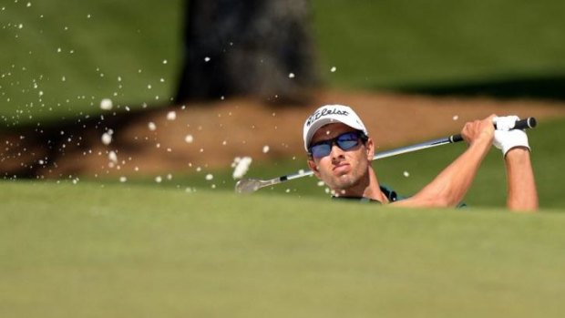 Adam Scott plays a shot during the first round of the 78th Masters at Augusta National Golf Club.