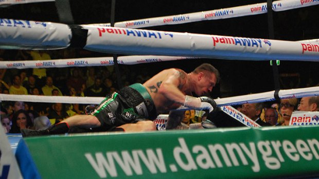 Danny down and out....Green hits the canvas after being knocked out by Krzysztof "El Diablo" Wlodarczyk
