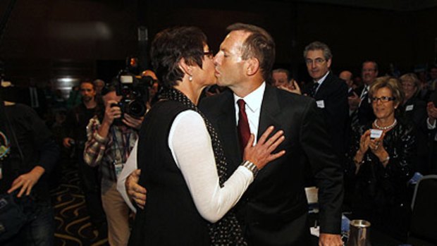 Margie and Tony Abbott in a public display of affection on the election trail in Perth.