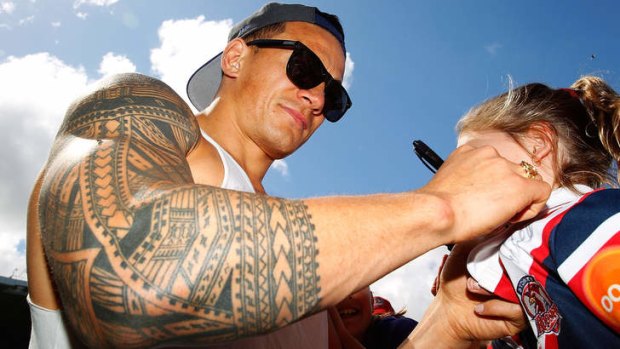 Olympic aspirations: Sonny Bill Williams with a Roosters fan.