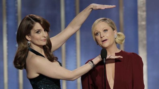 Happy to host Golden Globes: Tina Fey, left, and Amy Poehler won praise for their performance.
