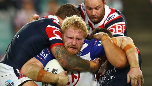 James Graham hits the Roosters defensive line.