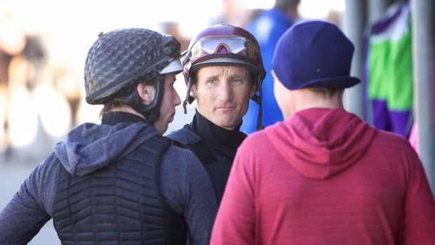 Back in action: Damien Oliver at Rosehill on Monday morning, where he rode in barrier trials.