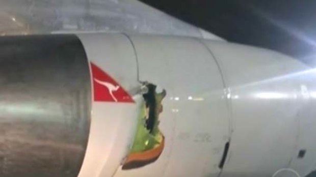 A Qantas jet was forced to turn back to San Francisco after a hole was blown in the shell of the engine.