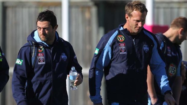 Back in blue ... fullback Anthony Minichello, left, pictured training with Mark Gasnier.