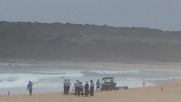 Police recover a body from the surf at Maroubra Beach on Friday.