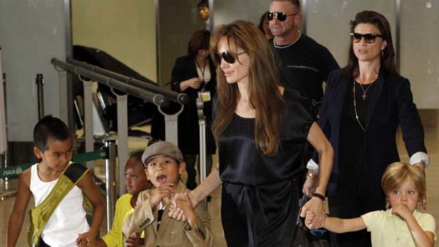 Turn around . . . Angelina Jolie with four of her six kids.