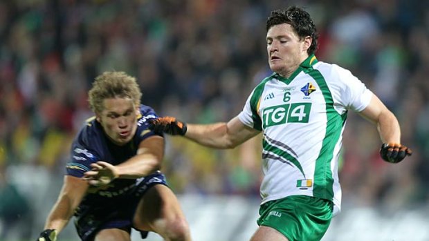 Marty Clarke (right) in action during the International Rules series between Ireland and Australia in Limerick last year.