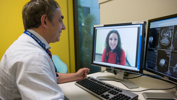 Professor Andrew Kornberg  from the Royal Children's Hospital in Melbourne, in a remote consultation with the mother of a young patient.